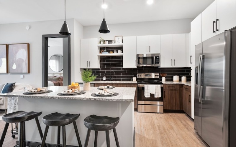 Modern apartment kitchen with stainless steel appliances at Vibe at Echo Street West