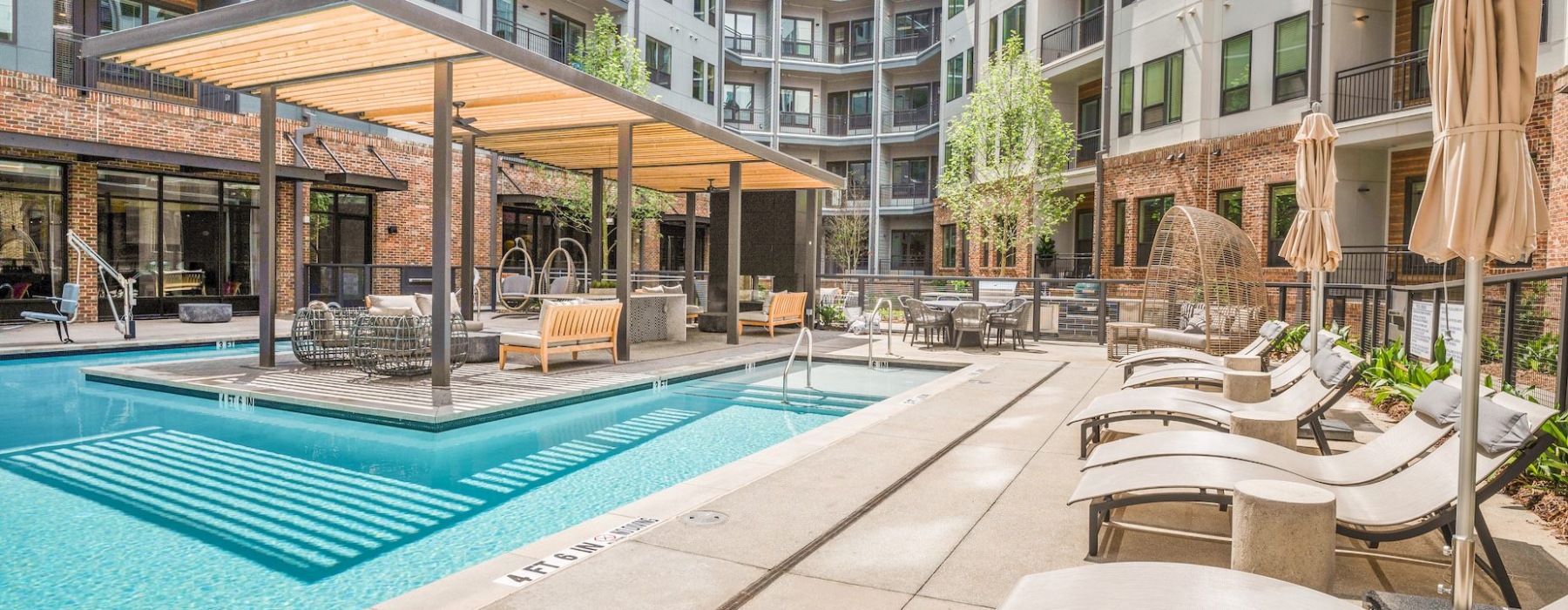 Ample pool deck seating around pool at Vibe at Echo Street West