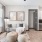Furnished living room with large window at Vibe at Echo Street West