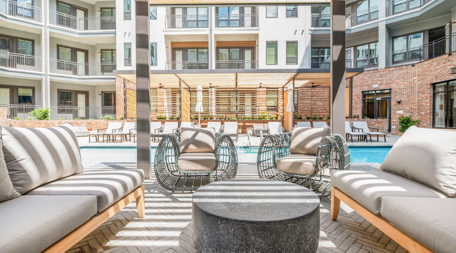 Ample outdoor seating near pool at Vibe at Echo Street West Ample outdoor seating near pool at Vibe at Echo Street West